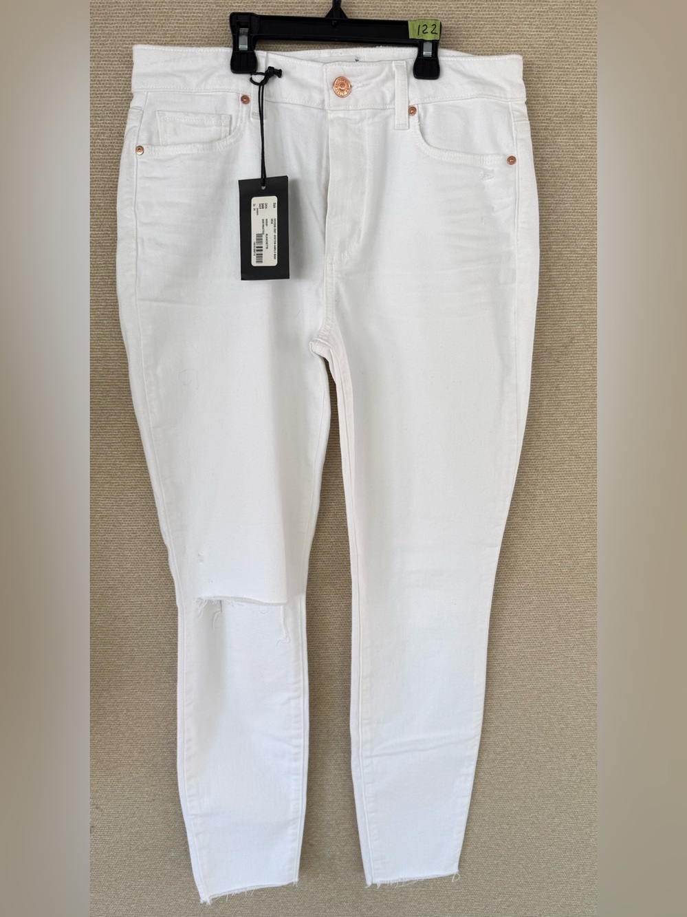 PAIGE White Skinny Jeans with Raw Hem and Knee Distress